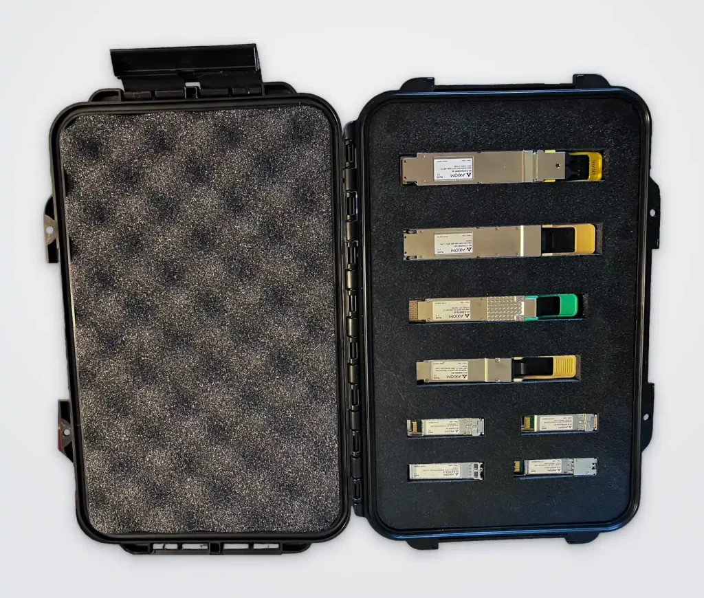 Open Axiom Connectivity case holding QSFP and SFP optical transceivers